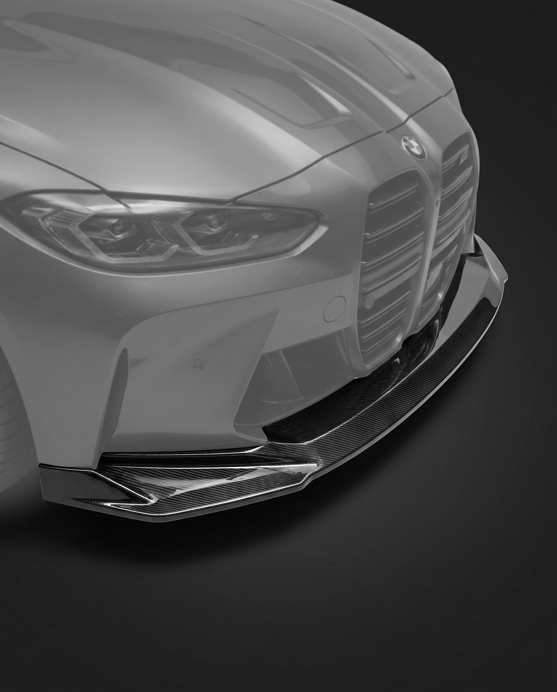 Gloss dry carbon fiber front lip splitter for BMW G80 M3 and G82 M4, vehicle ghosted, studio lighting reveals 2x2 twill weave depth