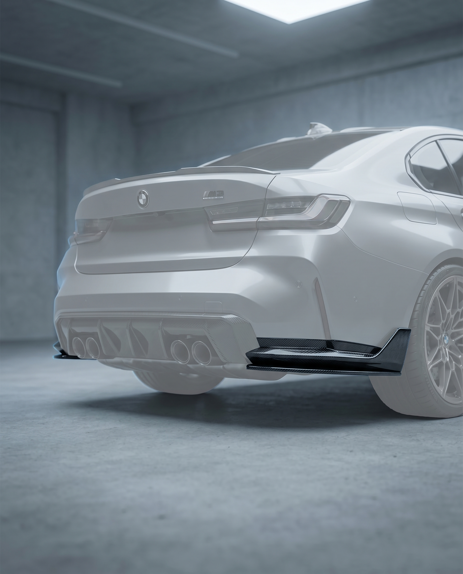Carbon diffuser side extensions installed flanking OEM diffuser on ghosted BMW G80 M3 rear, blurred premium garage, GT3-inspired aero