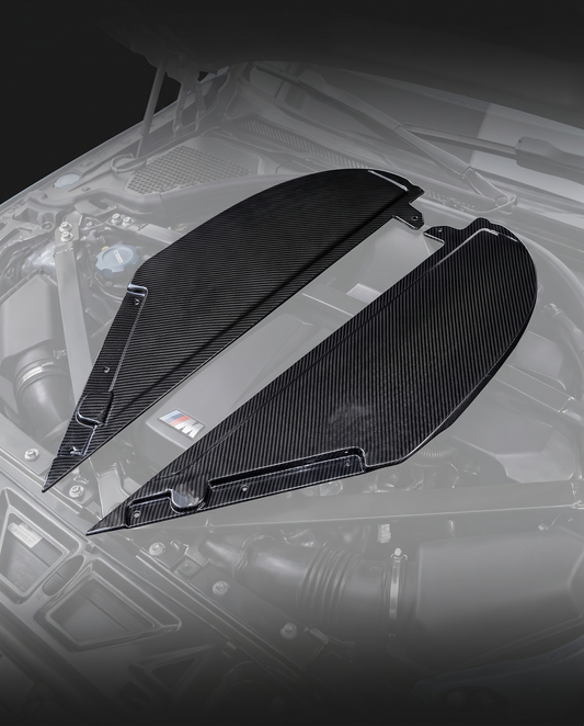 Gloss dry carbon fiber air intake cover for BMW G80 M3 and G82 M4, engine bay ghosted, studio light reveals 2x2 twill weave depth