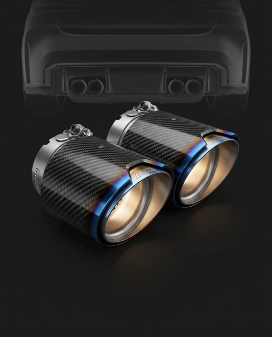 Angle-cut carbon fiber exhaust tips with burnt titanium finish for BMW G8X, rear ghosted, heat-gradient bluing and 2x2 twill sleeve