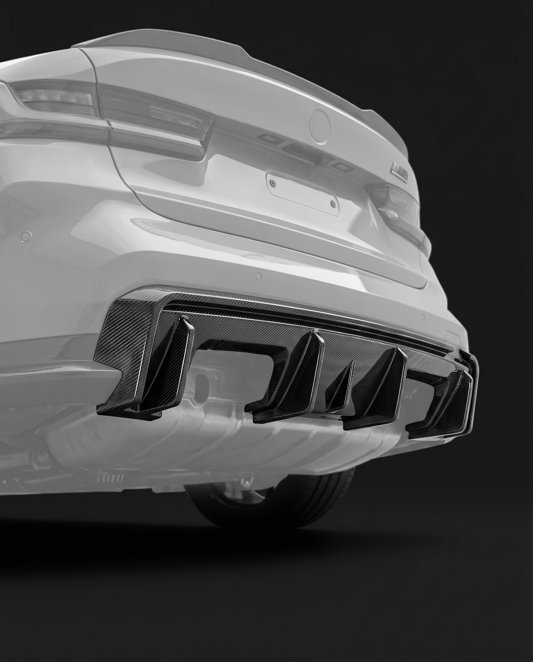 3D-style layered-fin gloss dry carbon rear diffuser for BMW G80 M3 and G82 M4, rear ghosted, layered fins with 2x2 twill weave