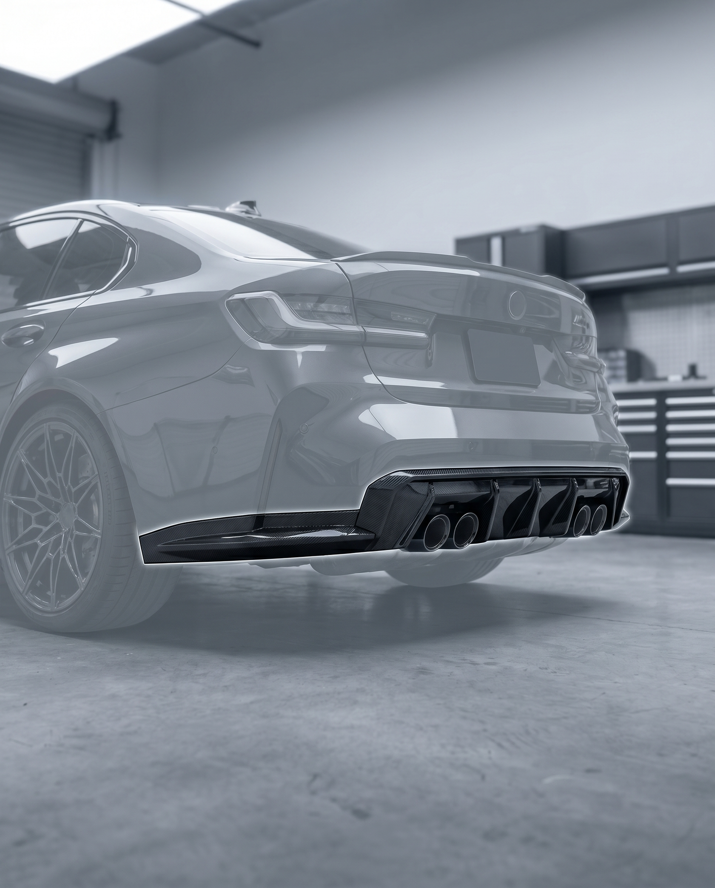 3D layered carbon diffuser installed under ghosted BMW G80 M3 rear bumper, aggressive motorsport rear aero, blurred premium garage