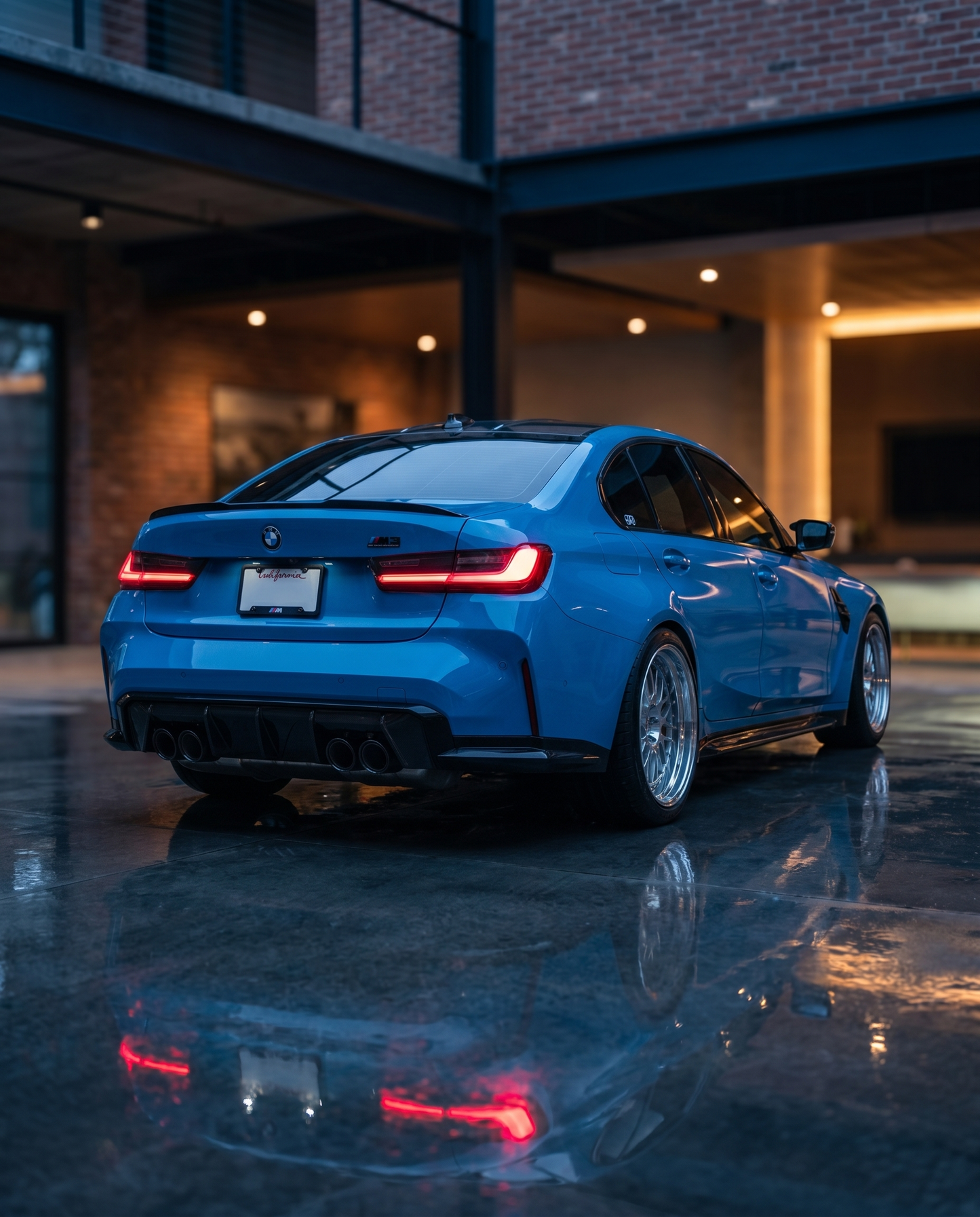 BMW G80 M3 rear at blue-hour dusk with smoked LED tail lights glowing red, reflective ground, stealthy moody motorsport scene