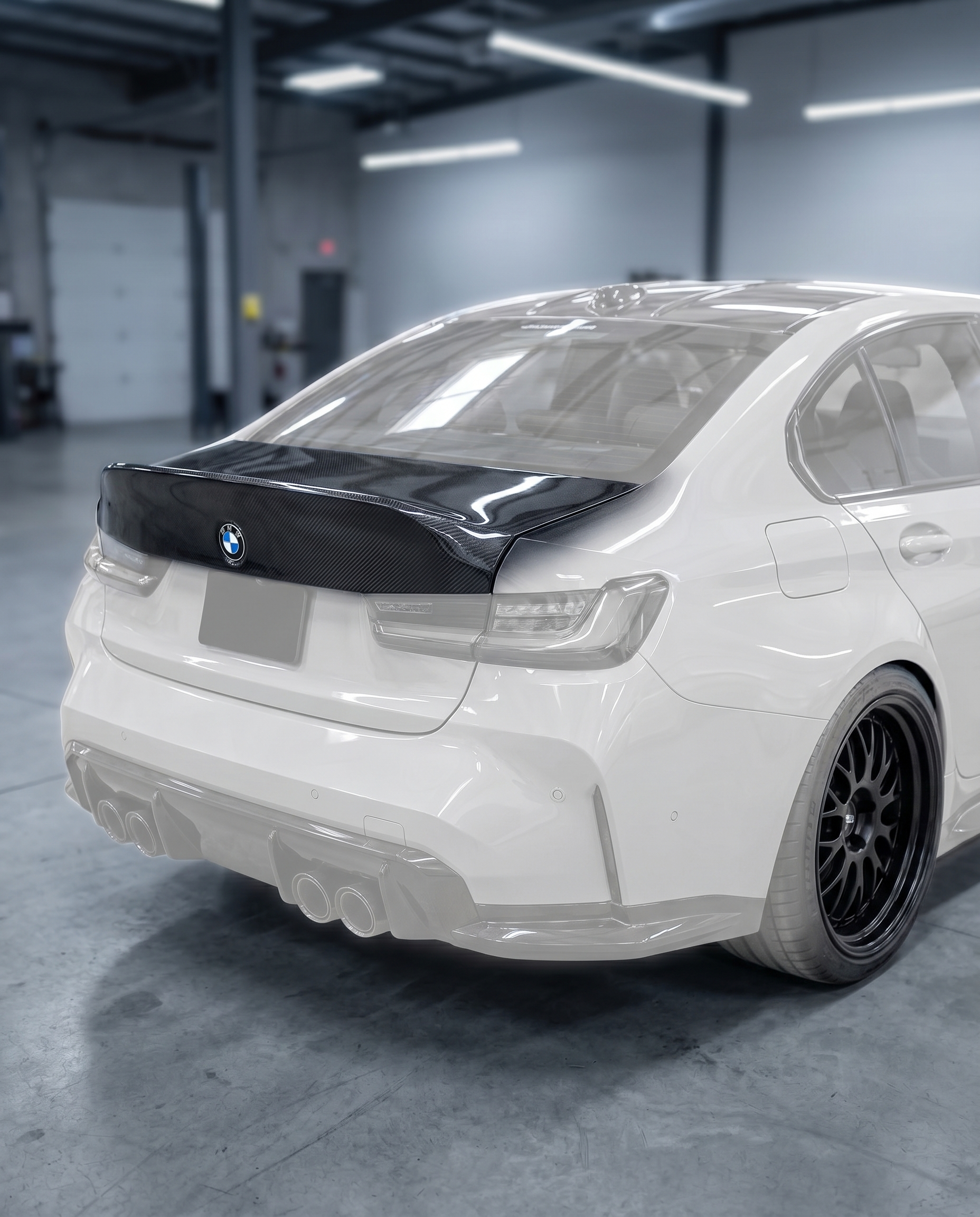 CSL carbon ducktail trunk lid installed on ghosted BMW G80 M3 rear, dramatic race-bred silhouette, blurred premium garage, OEM+ fit