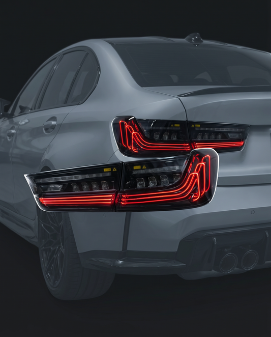 Handcrafted CSL laser LED tail lights for BMW G80 M3, studio hero shot with bold red laser light-bar signature lit