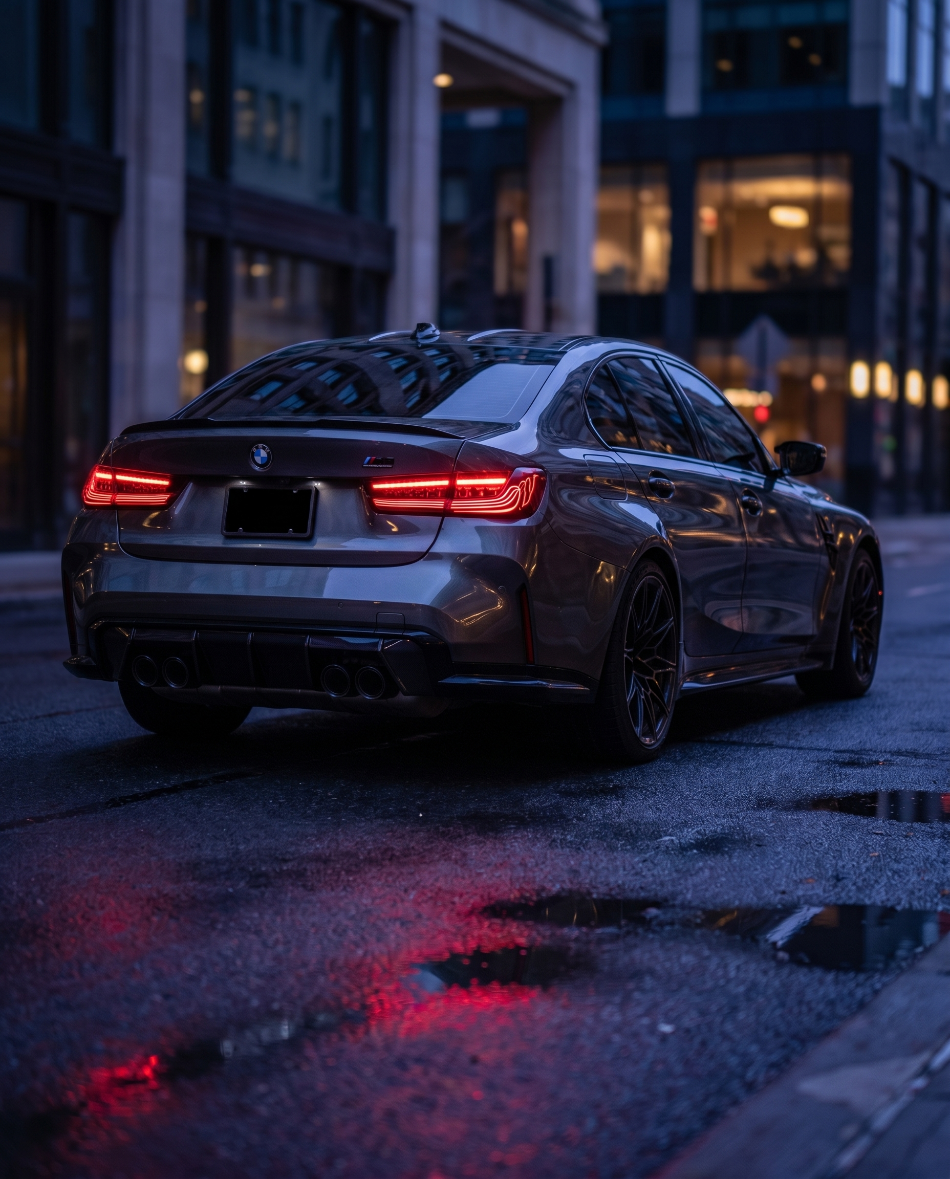 BMW G80 M3 at blue-hour dusk with CSL laser tail lights, red signature reflecting on wet ground in a cinematic rear shot