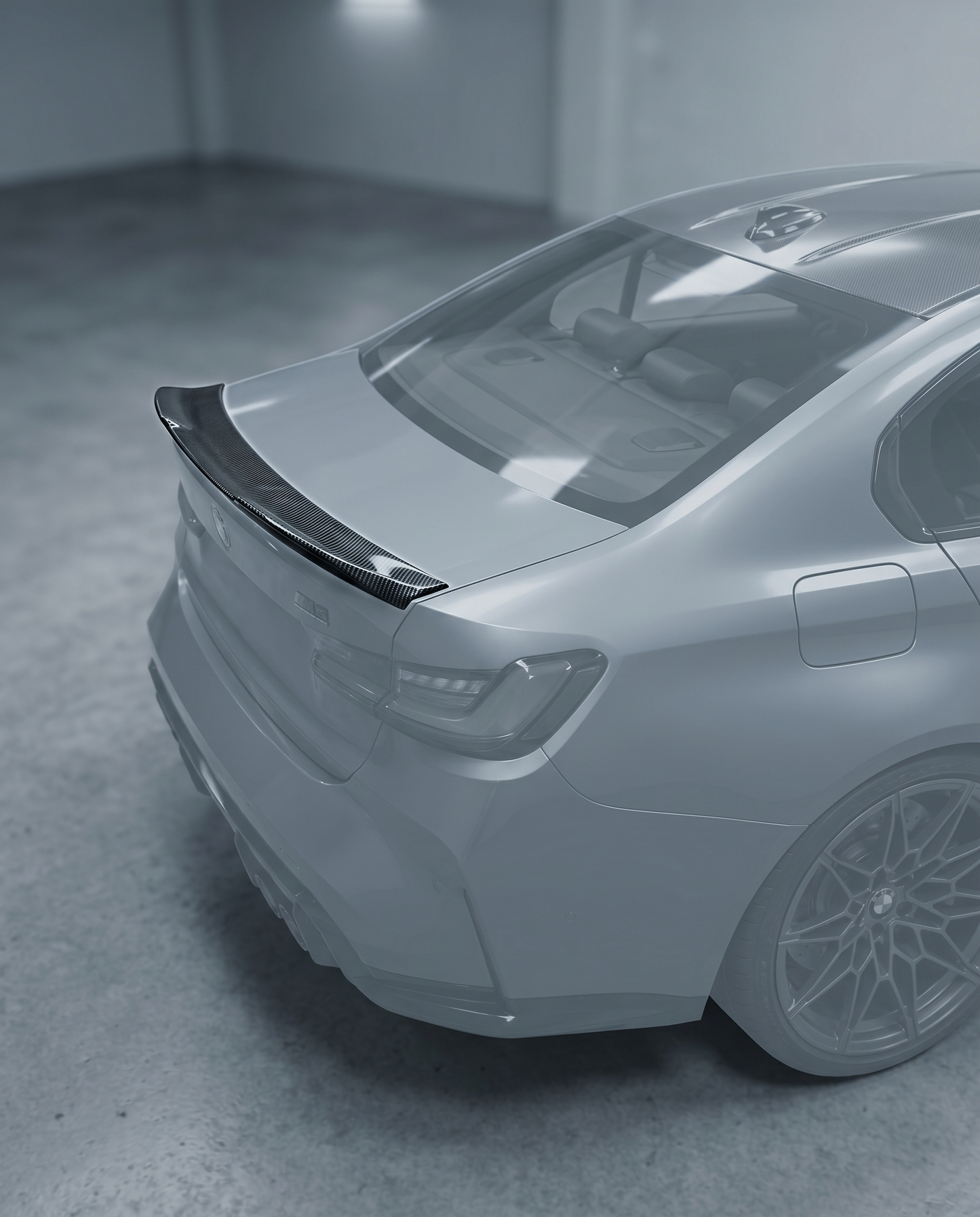 Gloss dry carbon PSM-style trunk spoiler installed on BMW G80 M3 rear, premium garage lighting shows clean tape-on fitment