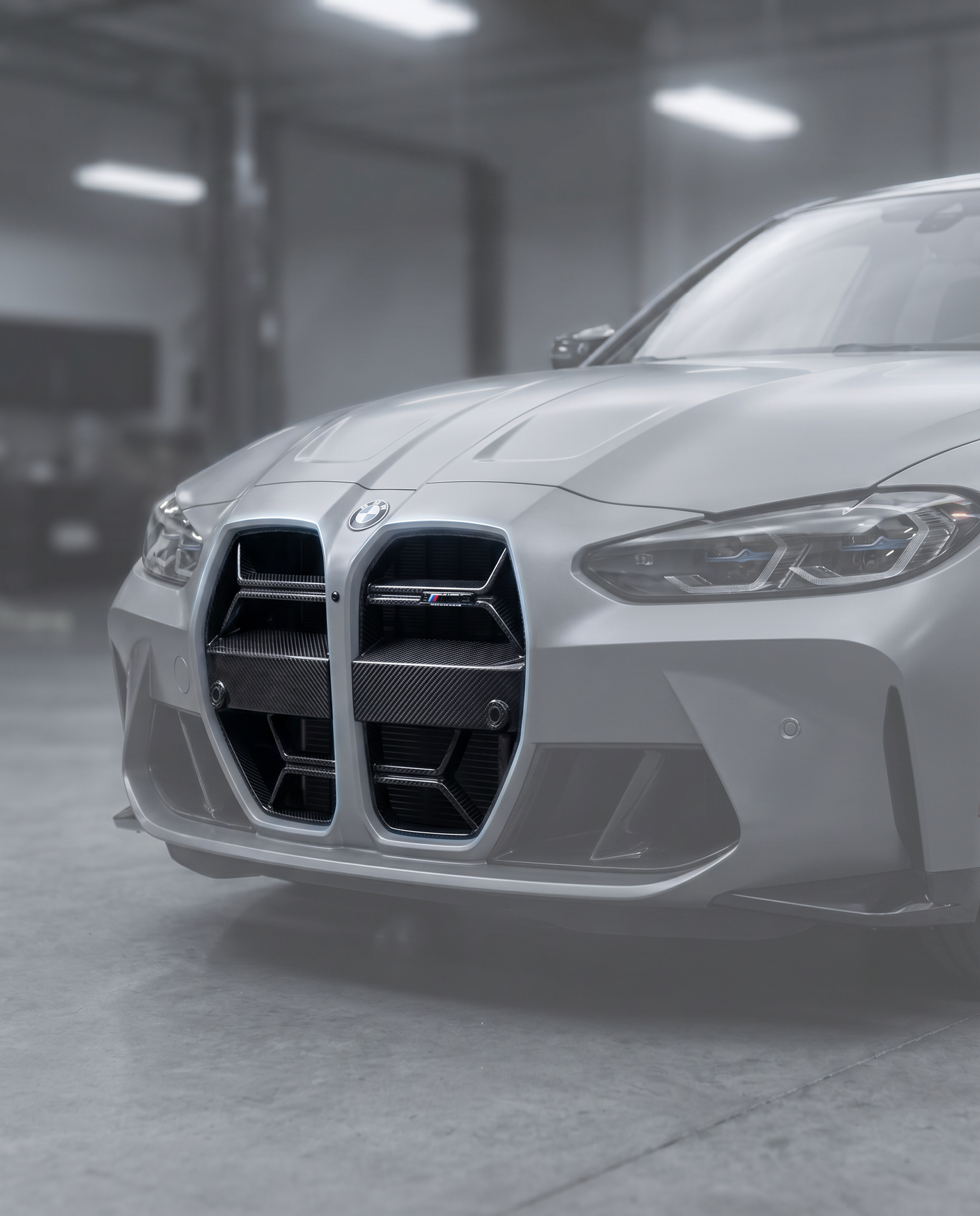 Gloss CSL carbon front grille installed on BMW G80 M3 front bumper, premium garage lighting shows clean OEM+ fitment