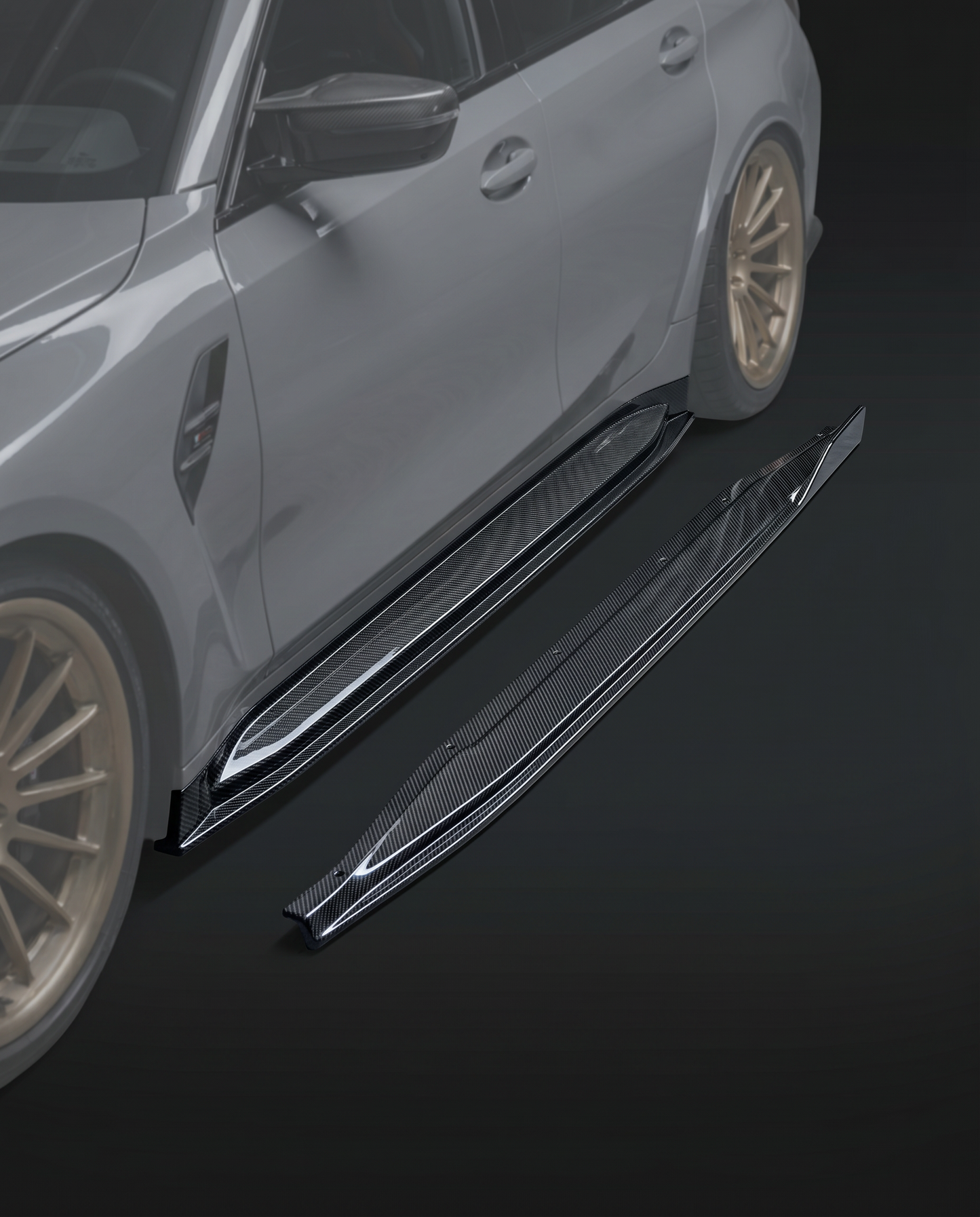 Gloss Type 2 carbon fiber side skirt extensions for BMW G80 M3, low studio hero shot showing slim profile and twill weave
