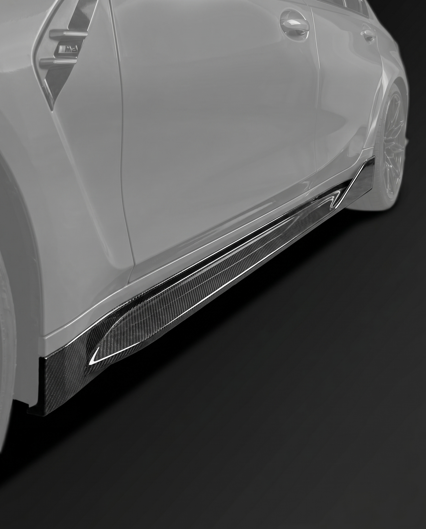 Gloss MP-style dry carbon side skirt extensions for BMW G80 M3, low studio hero shot showing slim profile and weave