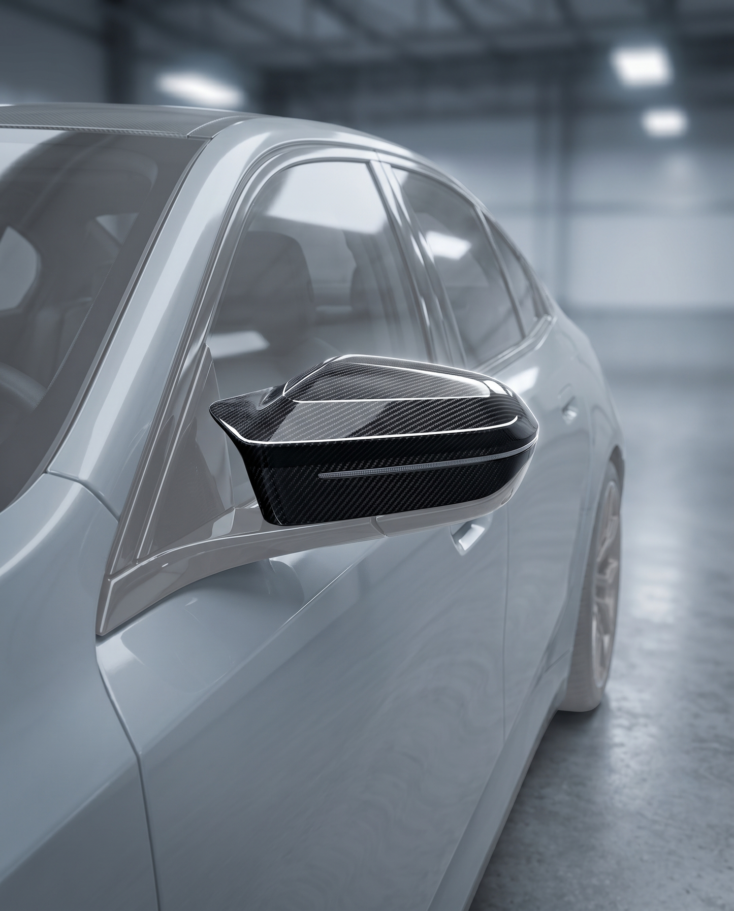 Gloss dry carbon mirror cover fitted on BMW G90 M5 side mirror, premium garage lighting shows clean direct-fit finish