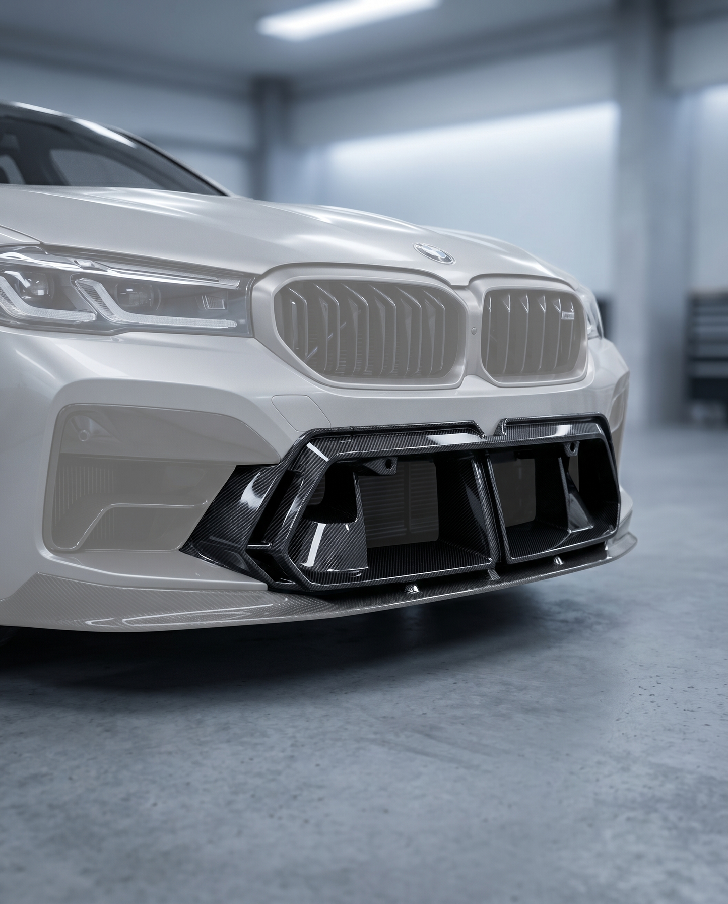 OE-style dry carbon front center vent installed in BMW G90 M5 bumper, premium garage lighting shows refined OEM+ fitment